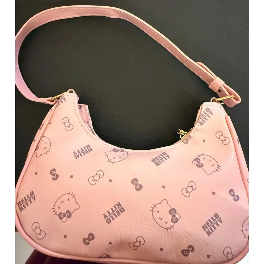 Hello Kitty Pink monogram crescent shoulder bag, all-over character print.